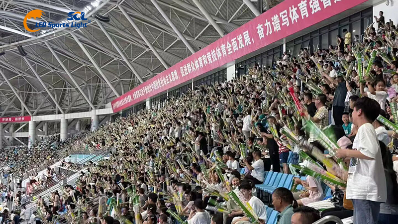 Crowd in stadium stands during sports event at Liaojunbo Sports Center