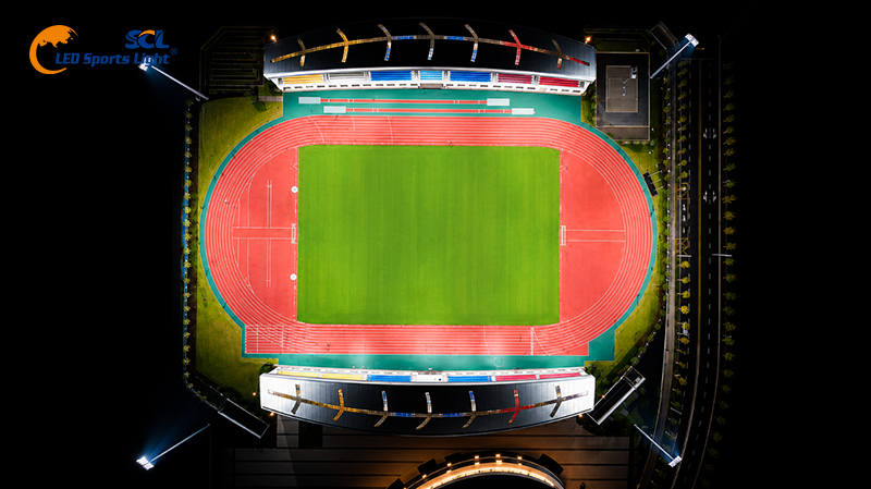 Aerial night view of athletics and football field with LED sports lighting system