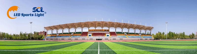 Full view of Hami Sports Center football stadium by Seven Continents Lighting, professional LED stadium lighting for 2026 Tongxin Cup Xinjiang Football League in windy Baili Wind Zone