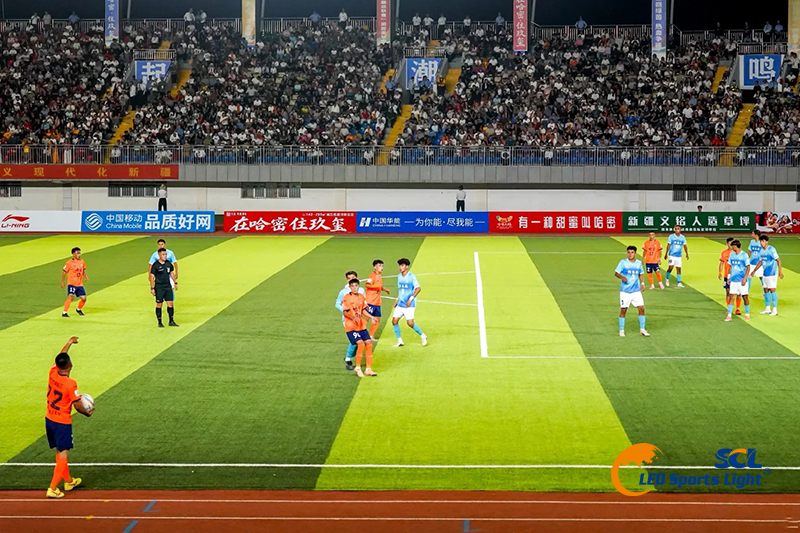 Full stadium lighting effect during Tongxin Cup match, wind & sand proof LED sports lights deliver uniform illumination for spectator stands