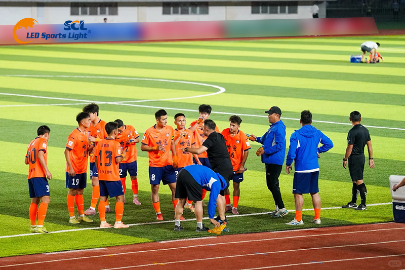 Night match scene of 2026 Tongxin Cup football league at Hami Stadium, even LED stadium lighting meets live broadcast illumination standard