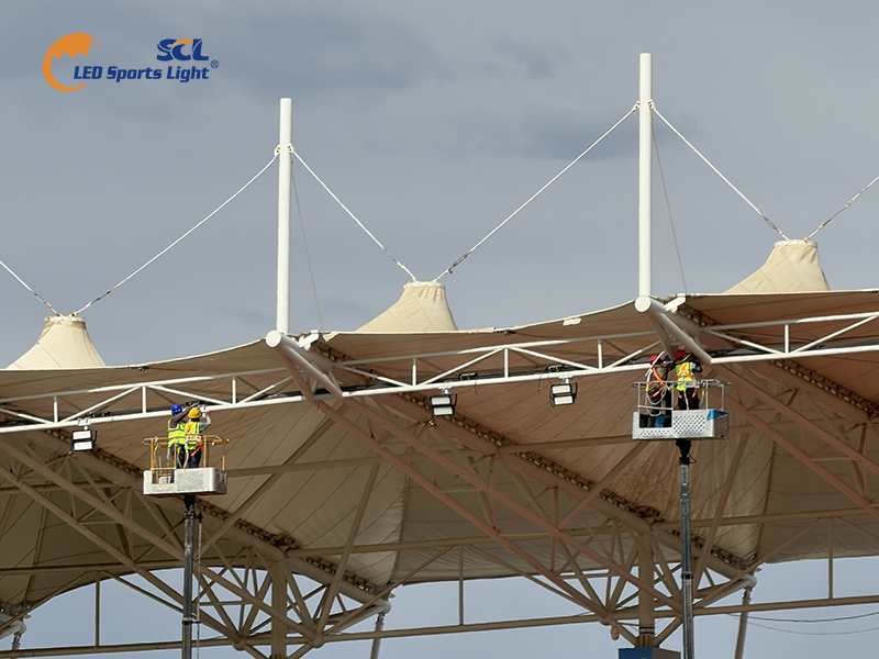 Installation of anti-corrosion LED floodlights on stadium grandstand roof, customized for Baili Wind Zone harsh environment