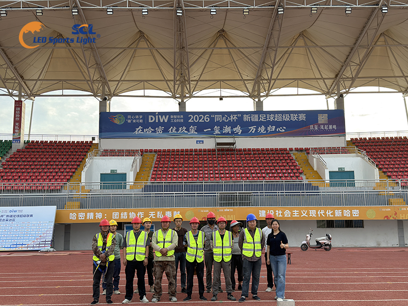 Team photo after completing Hami Stadium lighting project, professional sports lighting solution for extreme wind-sand area